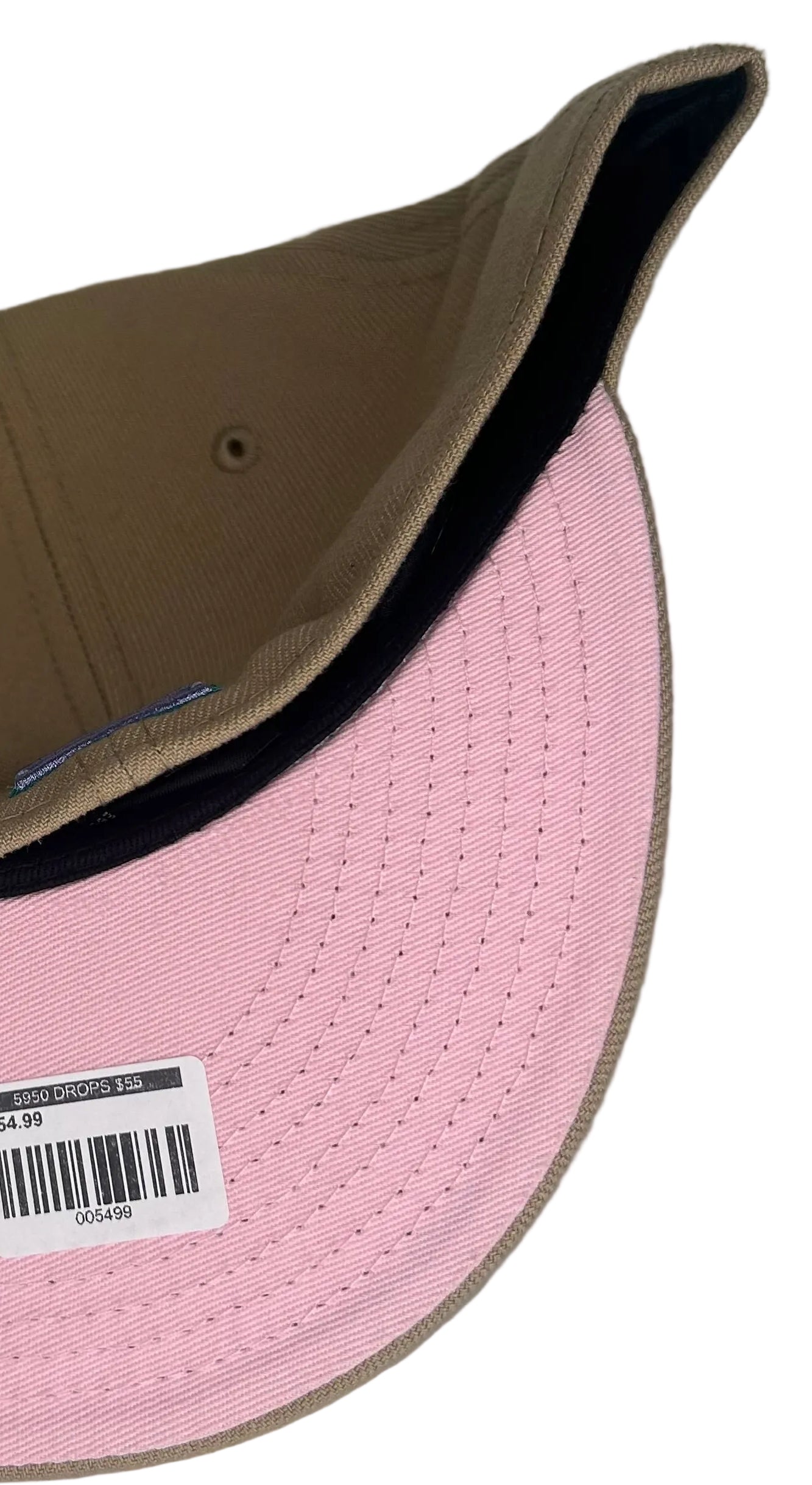 New Era Atlanta Braves 59FIFTY fitted hats from the Sandstorm Collection, featuring a tan colorway, a specialized side patch, and a vibrant pink under visor.
