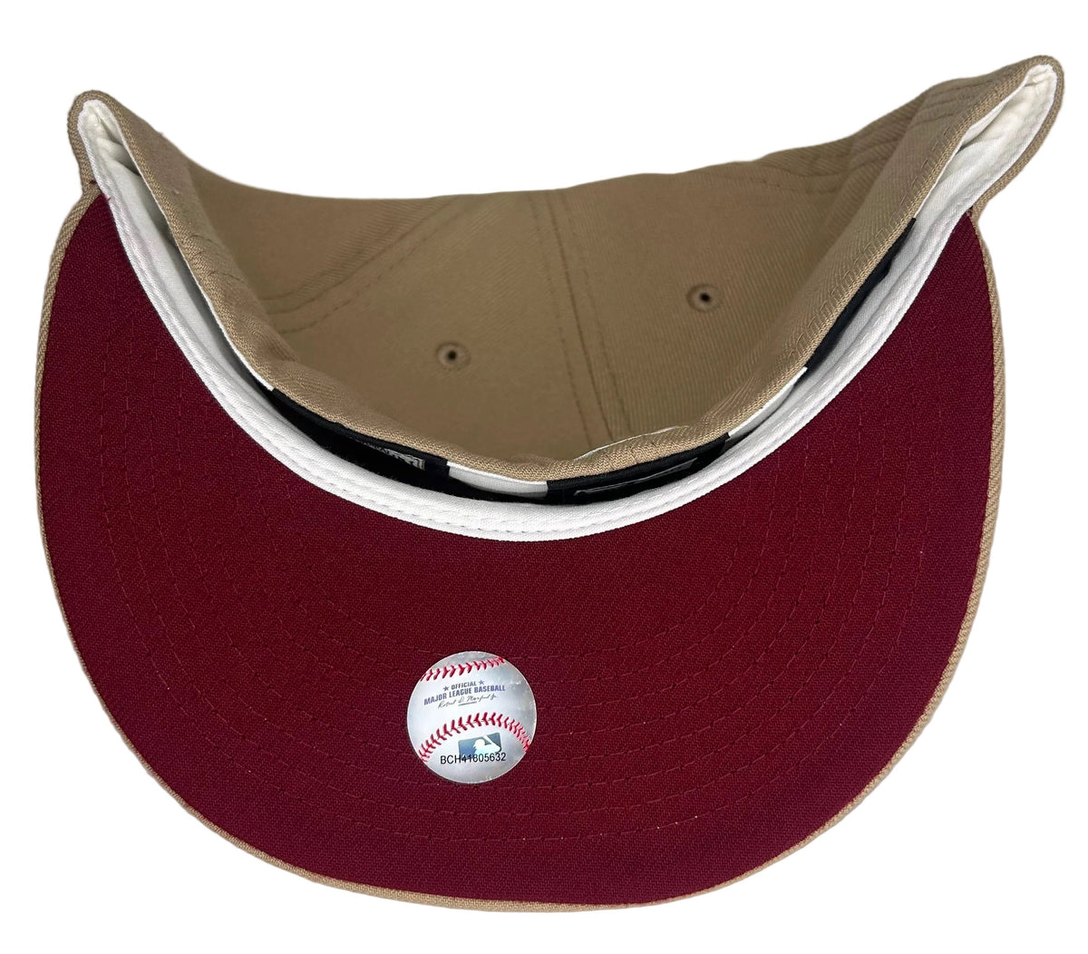New Era Montreal Expos 59FIFTY fitted hat
in a tan/brown colorway with pastel pink, yellow, and blue embroidery on the front logo.