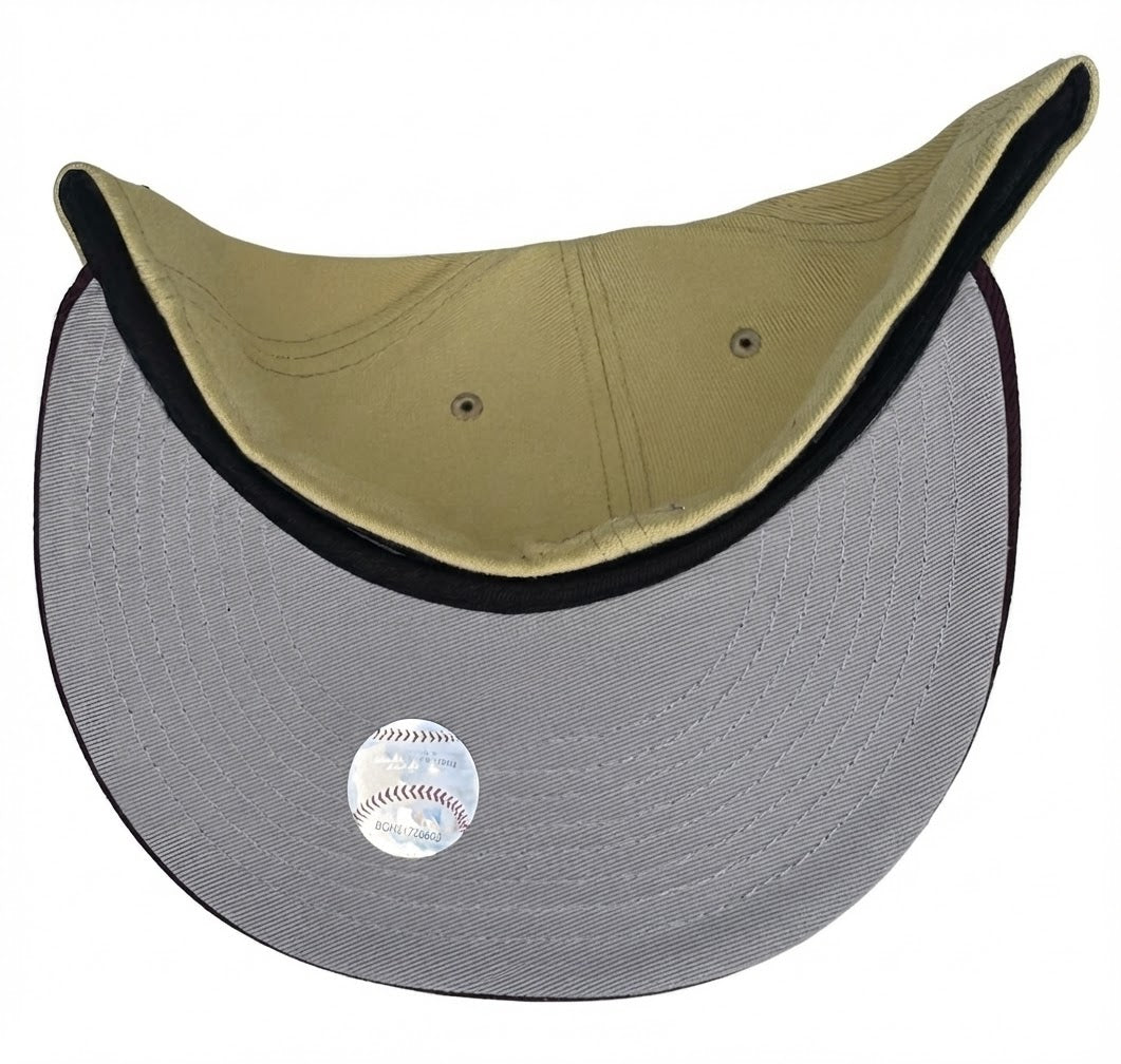 New Era Los Angeles Dodgers 59FIFTY fitted hat featuring a camel/vegas gold crown, a maroon visor, a silver script "D" logo, and a commemorative side patch.