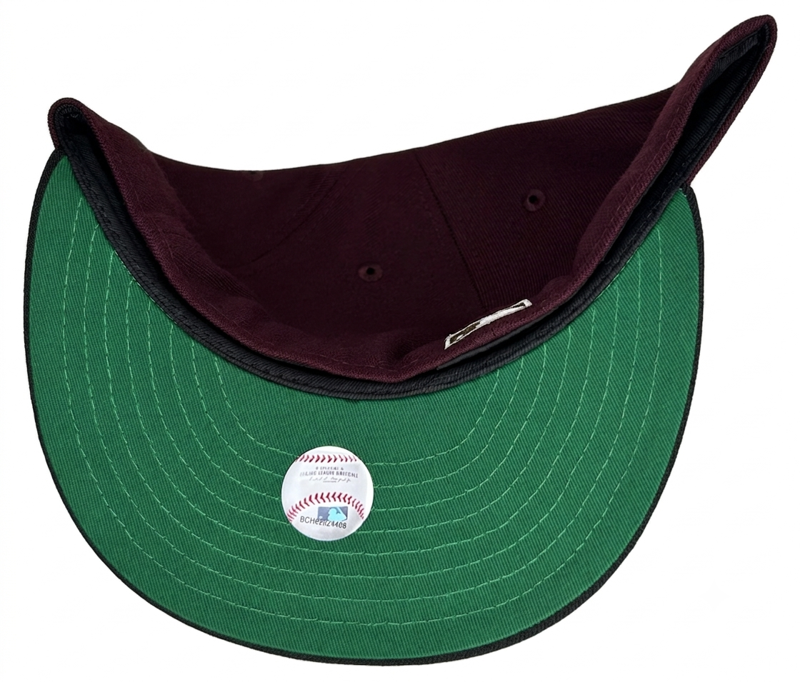 New Era 59FIFTY Chicago Cubs fitted hat features a maroon crown, black visor, and a special patch commemorating 100 years of Wrigley Field.