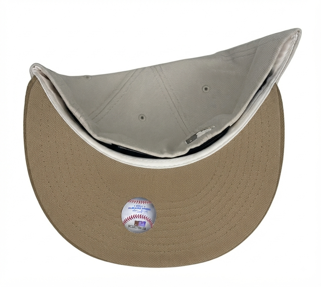 Minnesota Twins New Era 59FIFTY fitted hat features an off-white/grey crown, a tan flat brim, and a Hubert H. Humphrey Metrodome 1982–2009 side patch.