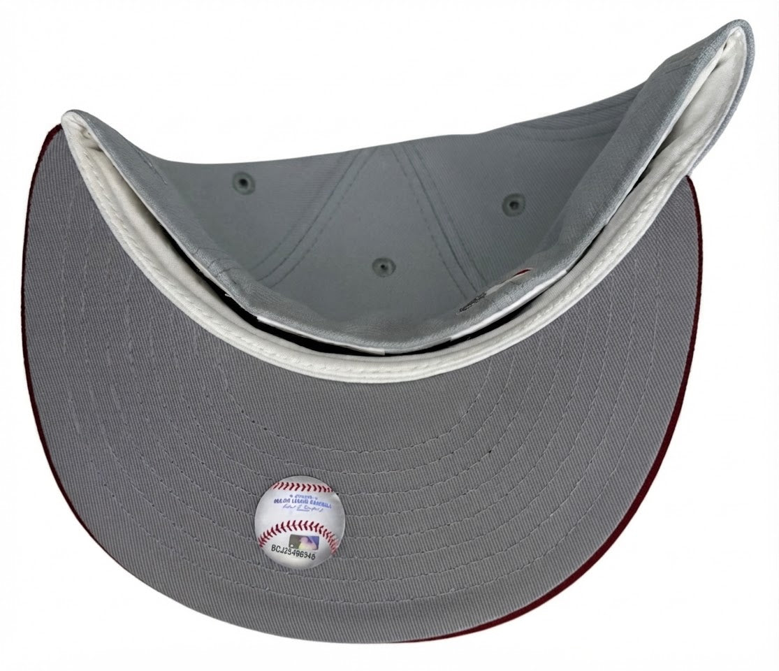New Era 59Fifty Baltimore Orioles fitted hat featuring a light gray crown, a burgundy visor, and an Oriole Park at Camden Yards 20th anniversary side patch.