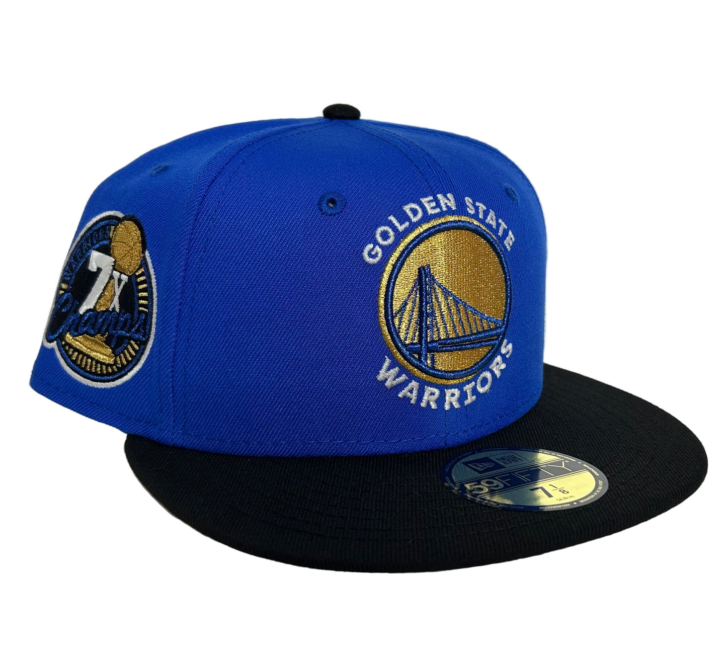 New Era Golden State Warriors 59FIFTY fitted hat in royal blue with a gray undervisor, featuring the team logo on the front and a "7X Champs" side patch.