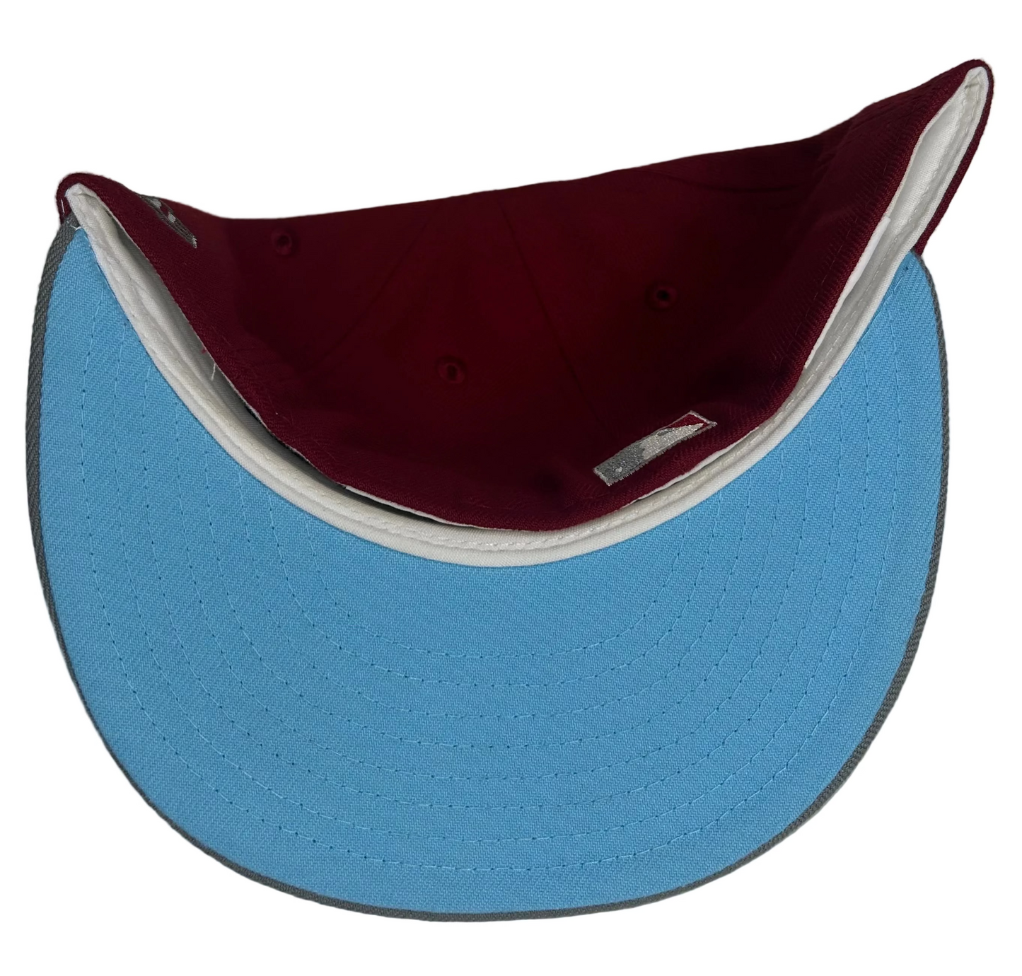 New Era 59FIFTY Seattle Mariners Baseball Club 40th Anniversary fitted hat featuring a burgundy/red lid, baby blue script lettering, & Icy Blue UV.
