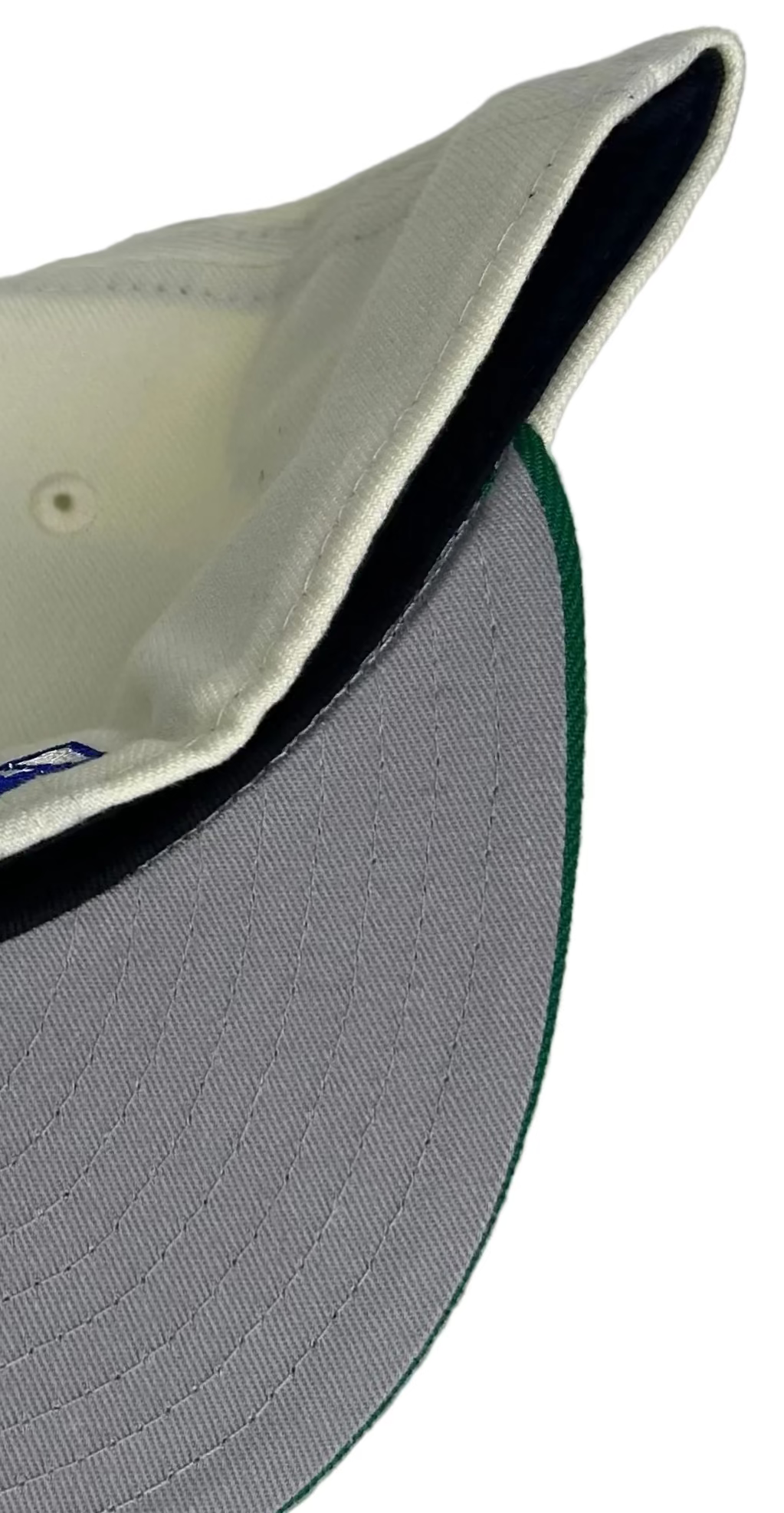 New Era Cleveland Indians 59FIFTY fitted hat, featuring a cream crown, green brim, and a patch commemorating the 1994 inaugural season at Jacobs Field.