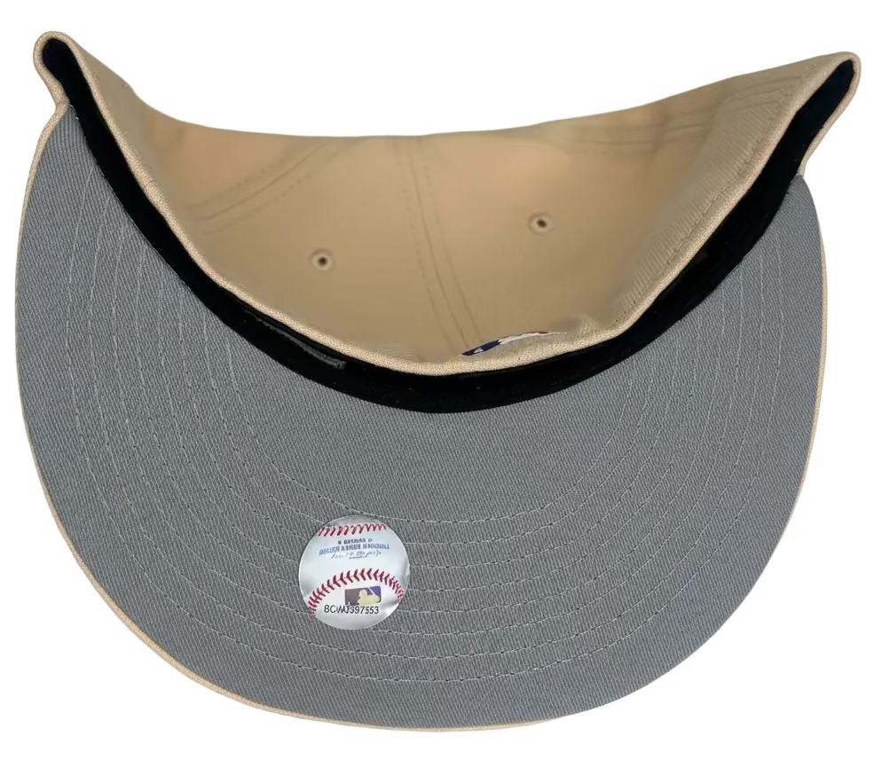 New Era Los Angeles Dodgers 60th Anniversary Script 59FIFTY fitted hat in a khaki or "mango mocha" colorway.