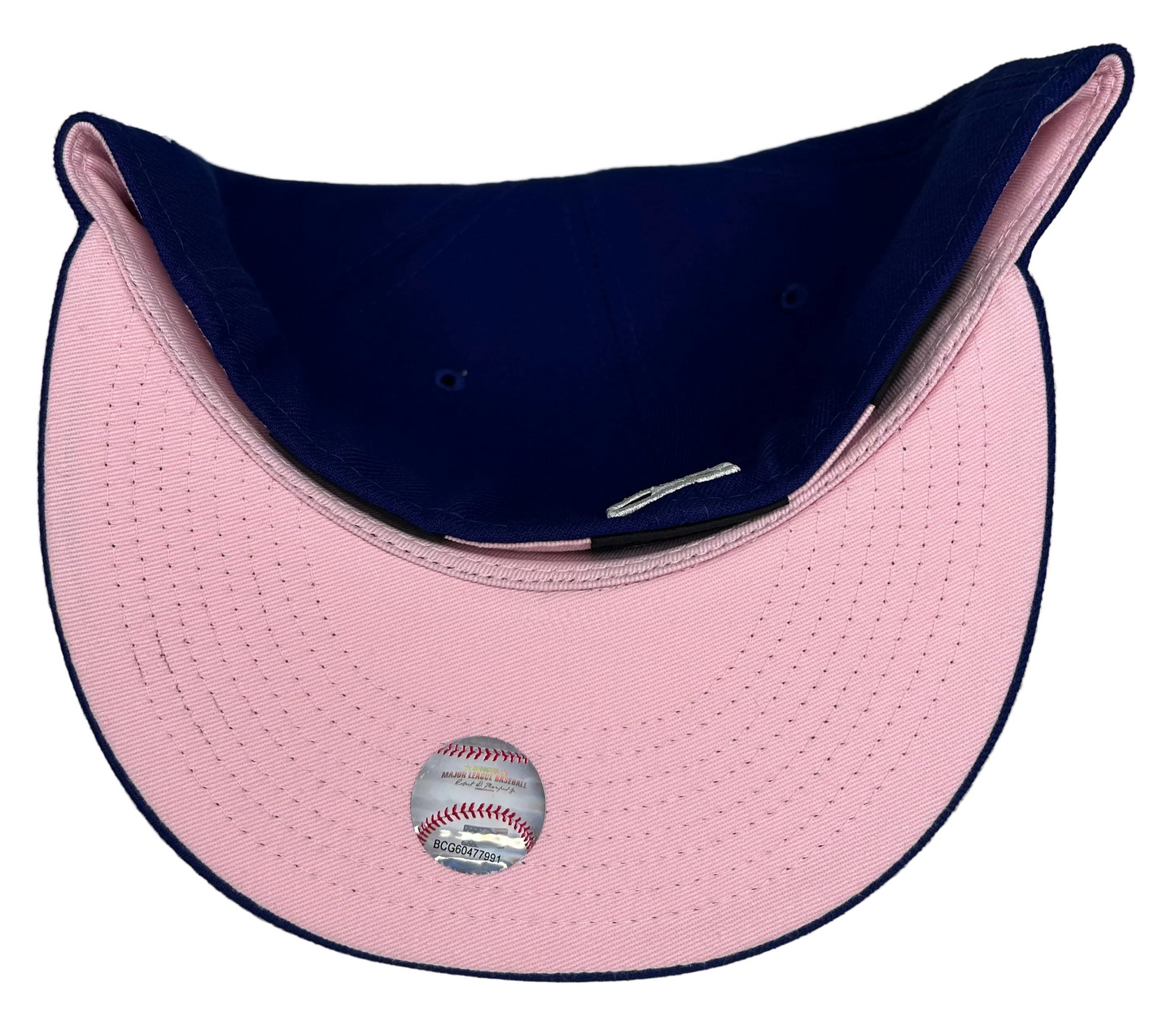 New Era Los Angeles Dodgers 59Fifty fitted hats featuring a royal blue crown and a light pink undervisor.
