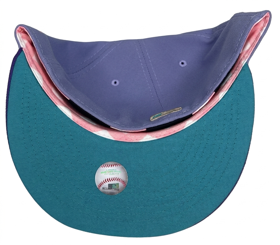 New Era Los Angeles Dodgers 59FIFTY fitted hat featuring a lavender crown and a purple visor with a 50th-anniversary patch.