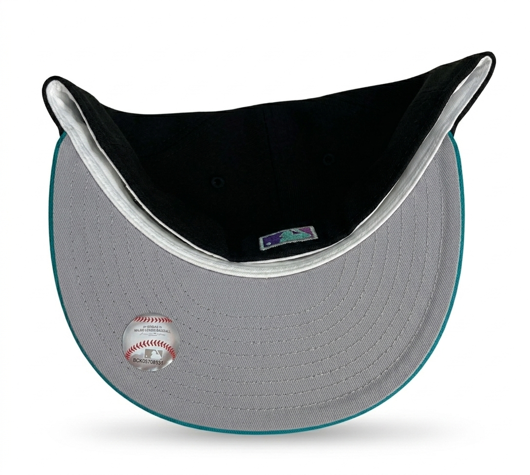 New Era Seattle Mariners 30th Anniversary Fitted Hat featuring a prominent teal brim.