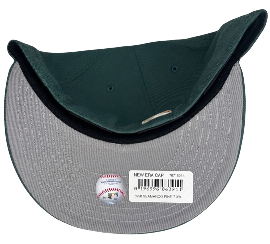 New Era Seattle Mariners 59FIFTY fitted cap in a dark green colorway with a metallic copper anniversary patch on the side.