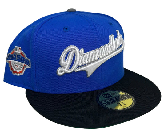 New Era 59Fifty Arizona Diamondbacks fitted hat featuring a metallic silver script logo on a royal blue crown with a black visor.