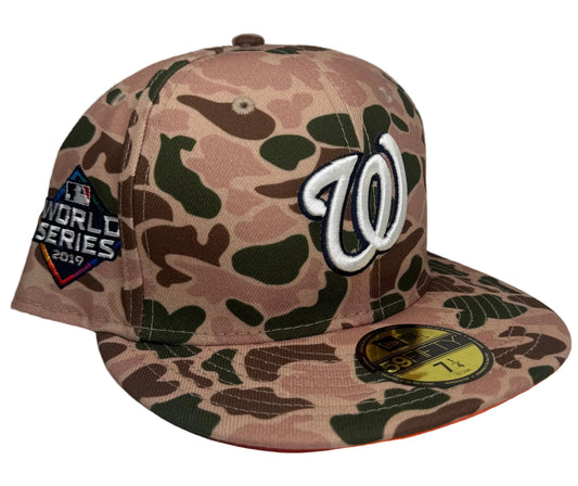 New Era Washington Nationals 2019 World Series Side Patch Duck Camo 59FIFTY fitted hat featuring a distinctive green and brown camo pattern with a contrasting orange undervisor.