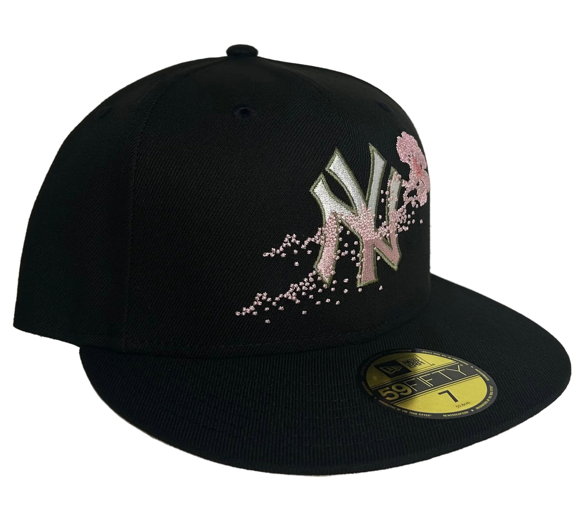 New Era 59FIFTY fitted hat features a black crown and a unique pink floral dotted Yankees logo.
