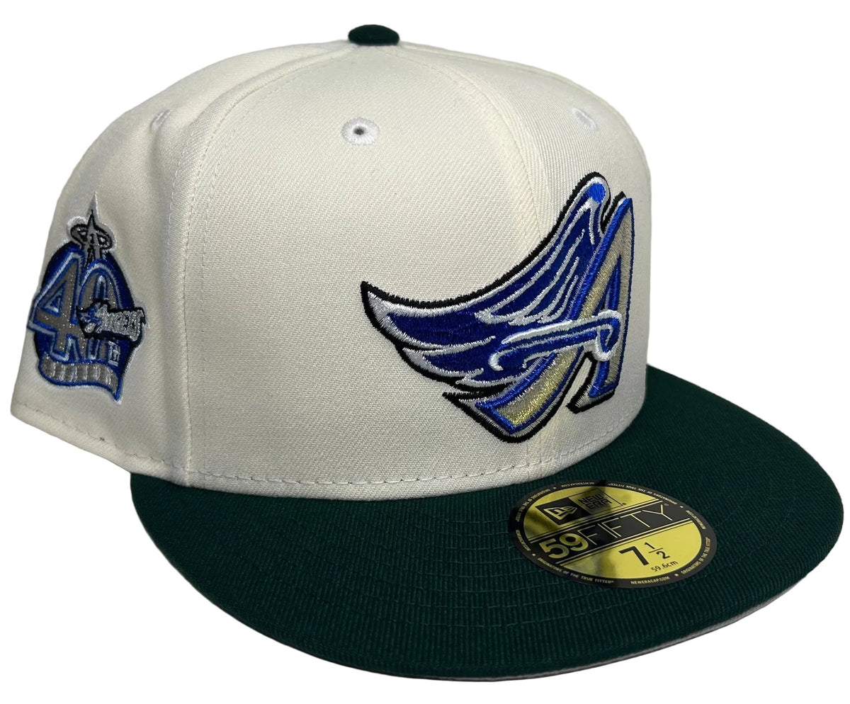 New Era Anaheim Angels W/ a 40th anniversary Patch 59FIFTY fitted hat featuring an off-white crown, a dark green brim, and a custom winged "A" logo.