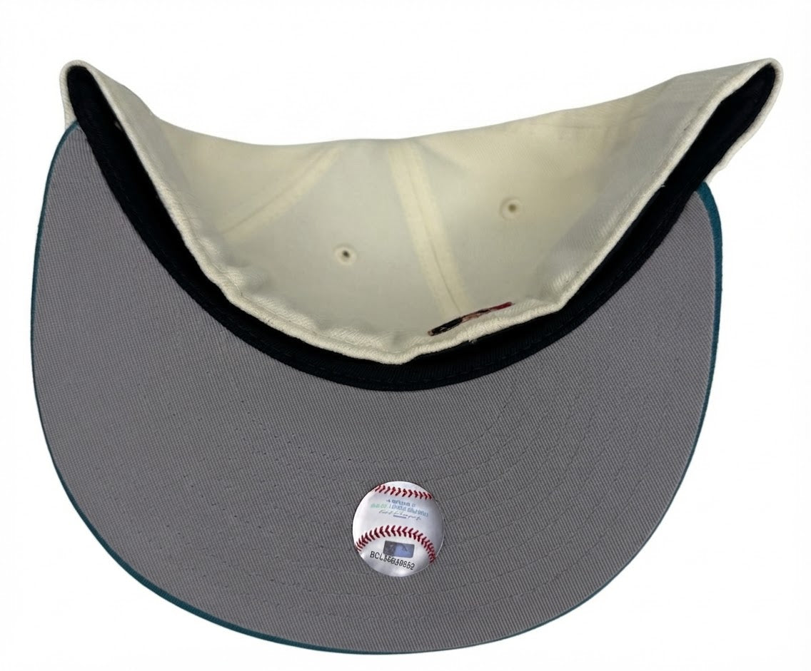 New Era Los Angeles Dodgers 59FIFTY fitted hat featuring an off-white crown, a teal flat bill, and a commemorative side patch.