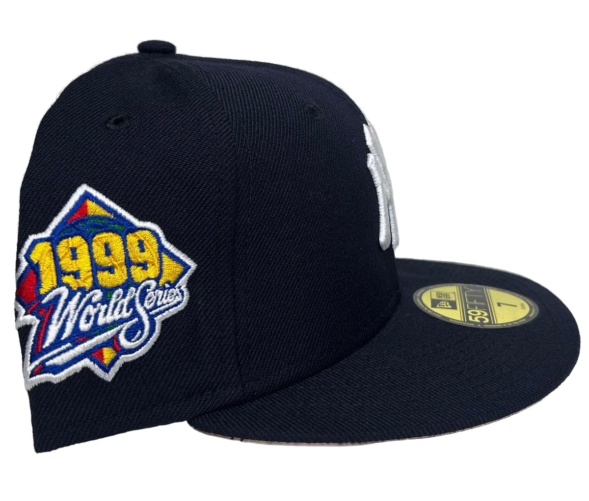 New Era New York Yankees 59FIFTY fitted hat featuring the embroidered 1999 World Series side patch on the right panel & a Pink UV.