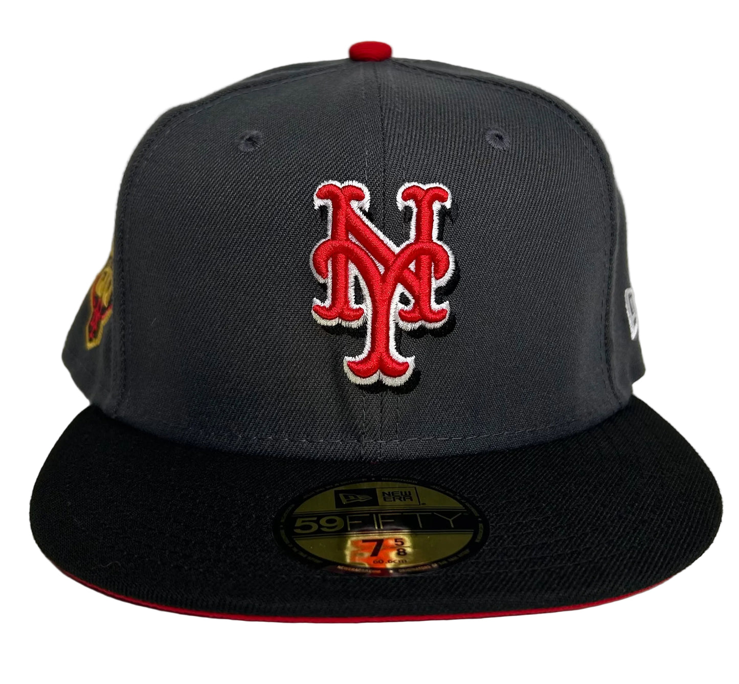 New York Mets 59FIFTY fitted hat by New Era features a gray crown, black brim with a red undervisor, and a celebratory 50th-Anniversary patch on the side. 