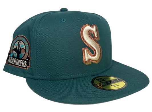 New Era Seattle Mariners 59FIFTY fitted cap in a dark green colorway with a metallic copper anniversary patch on the side.