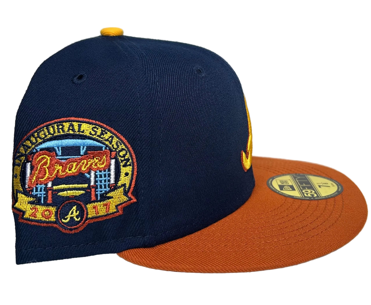 Atlanta Braves 59FIFTY Fitted Hat New Era, featuring a navy crown, orange brim, and a 2000 All-Star Game side patch.