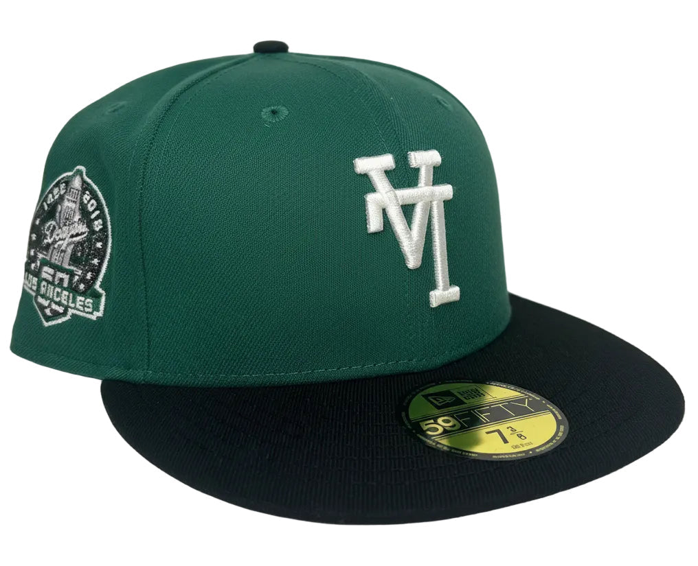 New Era Los Angeles Dodgers 59FIFTY fitted cap featuring a green crown, black visor, and an upside-down white logo.