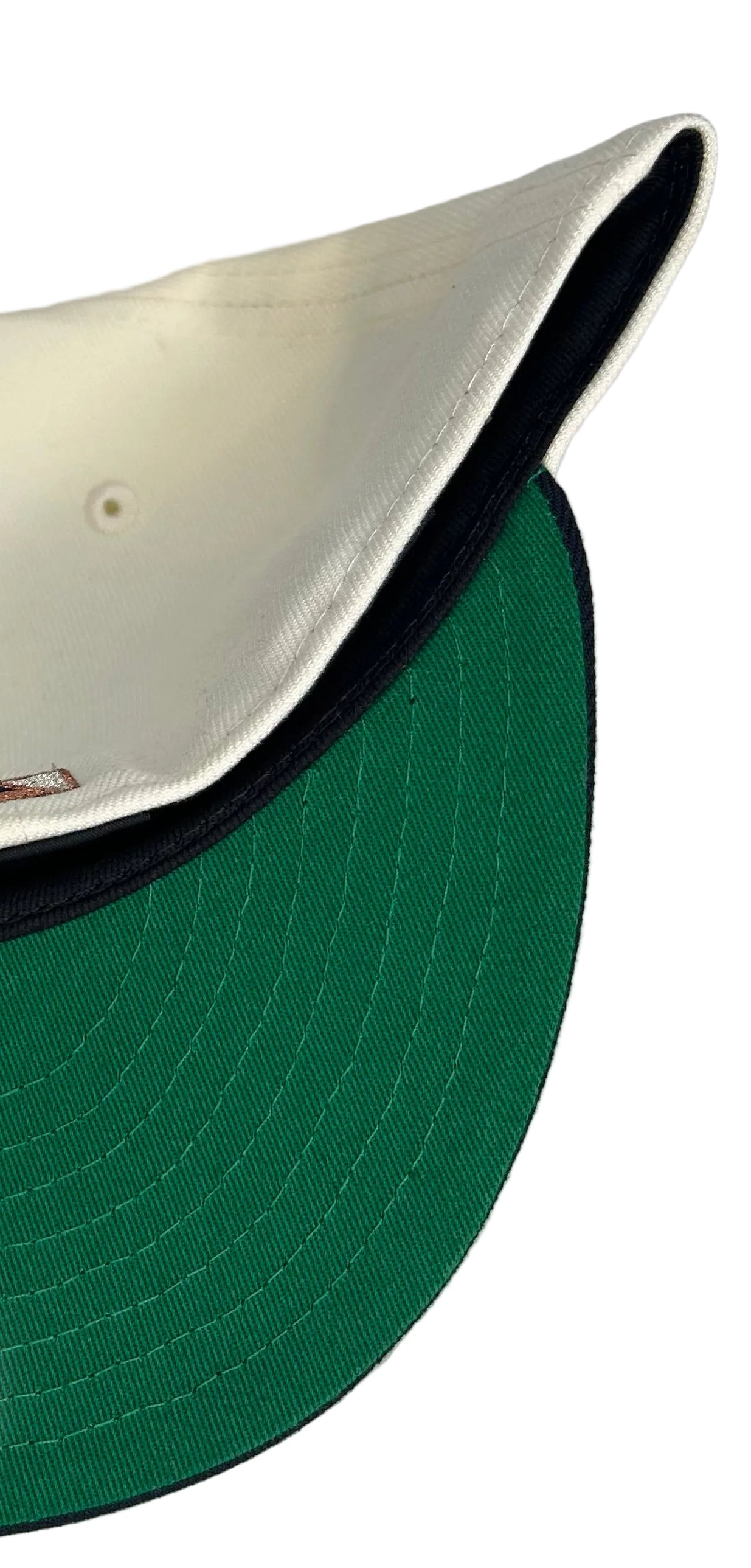 New Era 59FIFTY fitted Seattle Mariners hat features a unique white crown with a copper-colored "S" logo and a navy blue visor.
