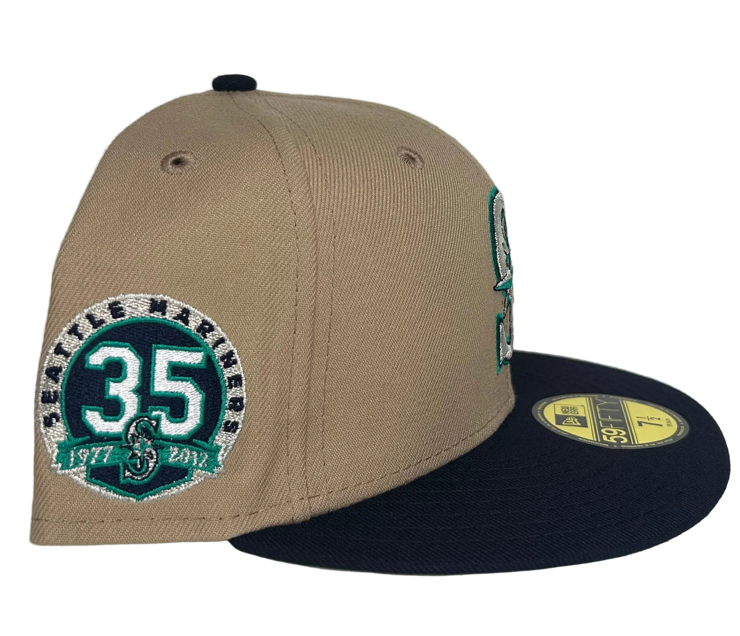 New Era 59FIFTY Seattle Mariners fitted hat features a camel brown crown, navy blue visor, and a 35th Anniversary side patch.