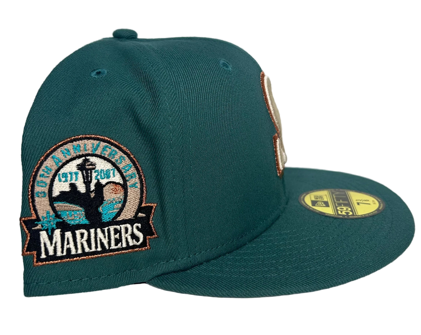New Era Seattle Mariners 59FIFTY fitted cap in a dark green colorway with a metallic copper anniversary patch on the side.
