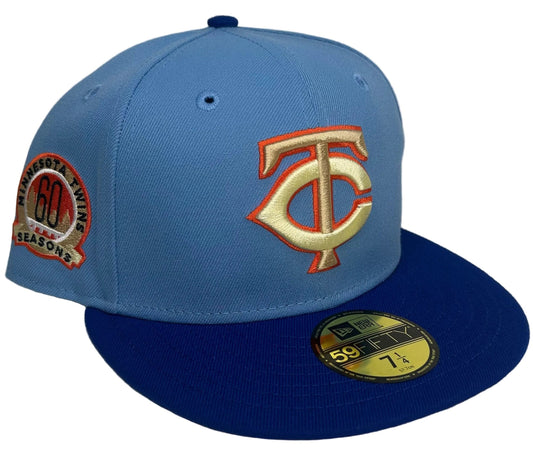 Minnesota Twins 60th Anniversary New Era 59FIFTY Fitted Hat features a royal blue visor and a commemorative "60 Seasons" side patch.