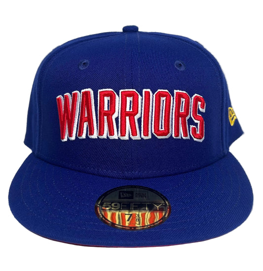 New Era 59FIFTY Golden State Warriors royal blue fitted cap featuring raised red and white "WARRIORS" block lettering across the front crown.
