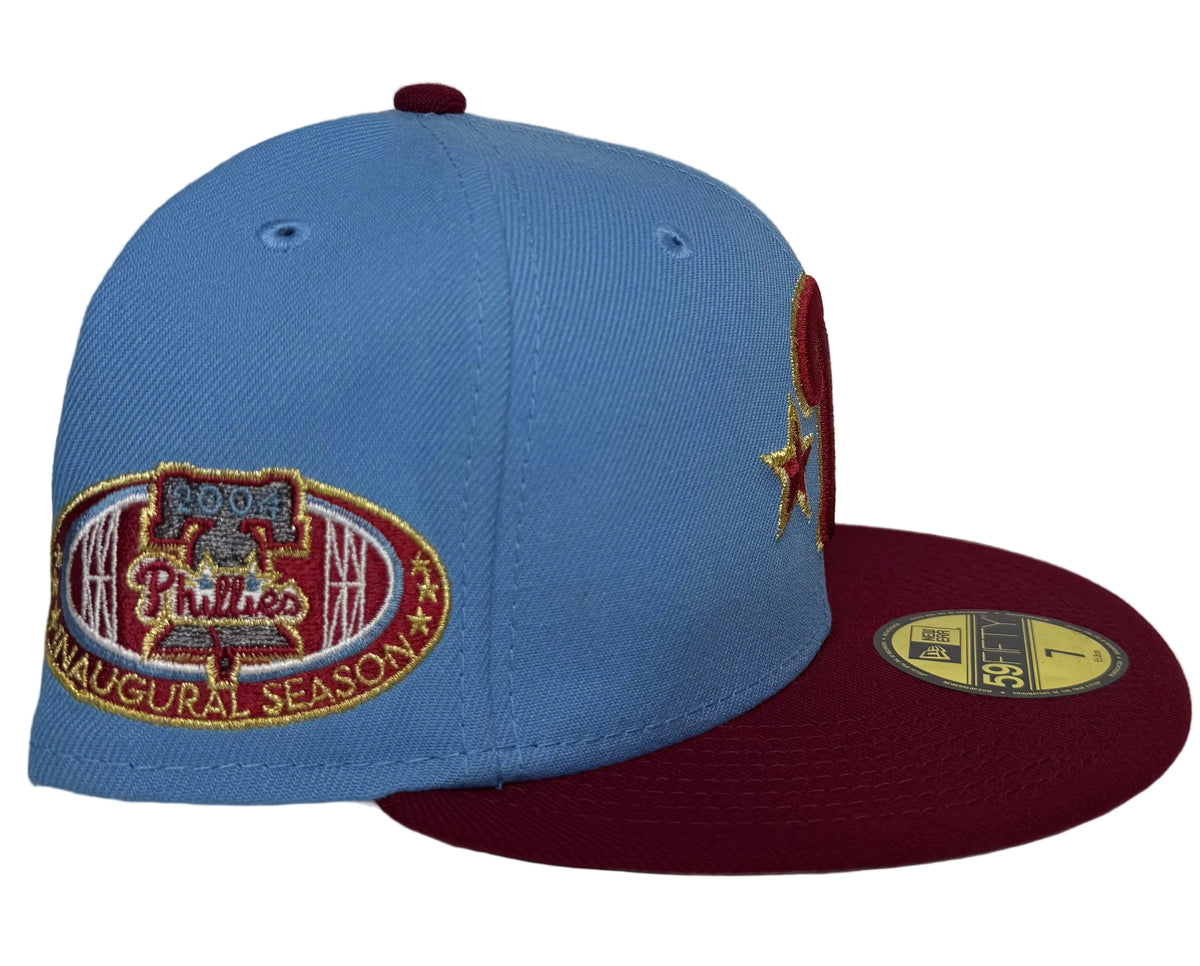 New Era 59FIFTY Philadelphia Phillies Off-White/Burgundy/Icy Blue 2004 Inaugural Season Fitted Hat, featuring a light blue crown and a striking burgundy visor.