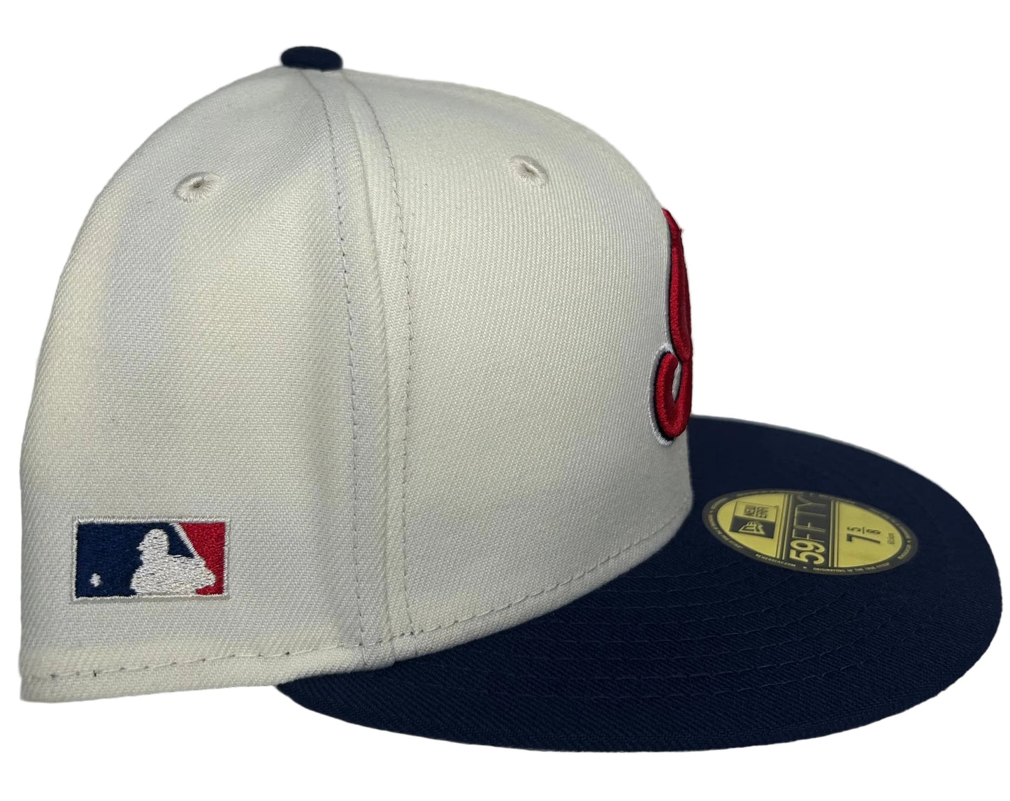 New Era 59FIFTY Cleveland Indians fitted cap featuring a cream-colored crown and a navy brim.