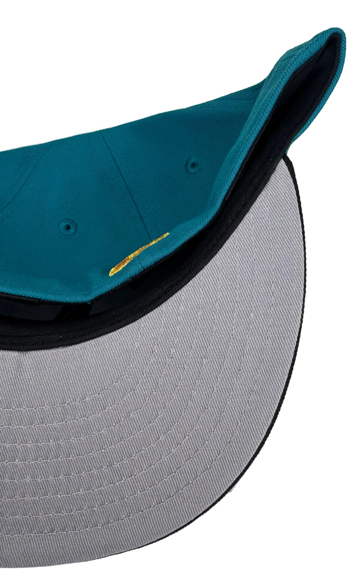New Era 59FIFTY Atlanta Braves fitted hat Teal/ Black features a metallic gold and white embroidered "A" logo alongside a commemorative side patch.