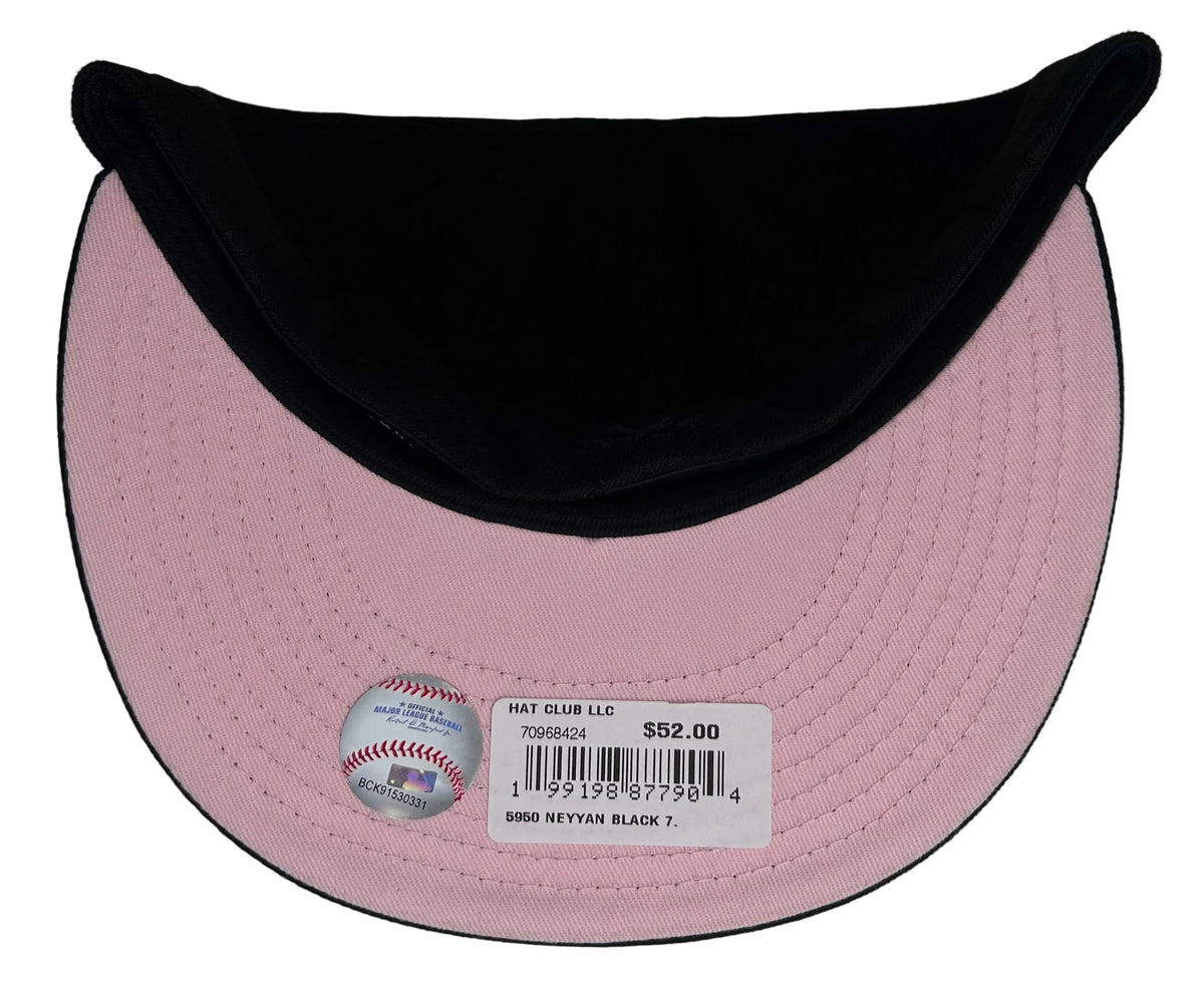New Era 59FIFTY fitted hat features a black crown and a unique pink floral dotted Yankees logo.