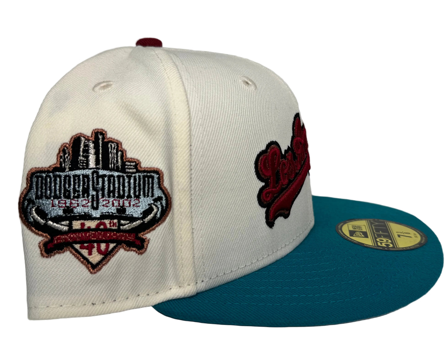 New Era Los Angeles Dodgers 59FIFTY fitted hat featuring an off-white crown, a teal flat bill, and a commemorative side patch.