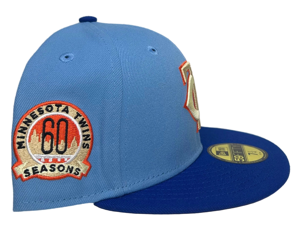 Minnesota Twins 60th Anniversary New Era 59FIFTY Fitted Hat features a royal blue visor and a commemorative "60 Seasons" side patch.