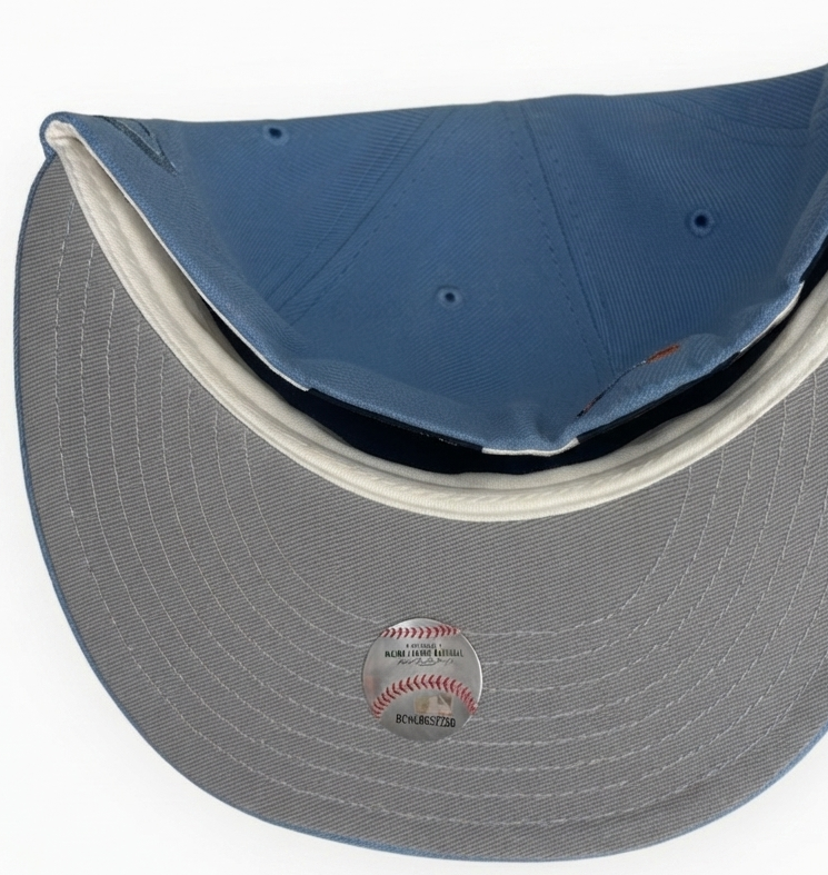 Chicago Cubs “Blastoise”New Era 59FIFTY fitted hat features a distinctive sky blue color with a copper-accented bear logo and a 1990 All-Star Game side patch.