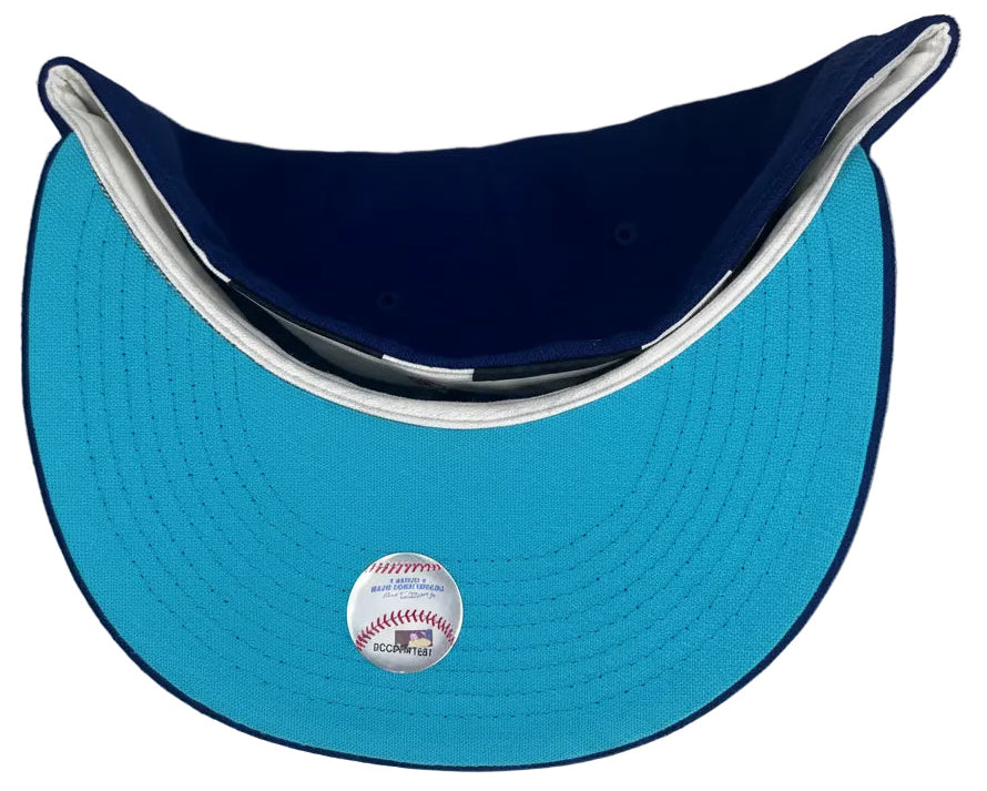 New Era Los Angeles Angels 59FIFTY fitted hat in royal blue with a yellow and pink logo.