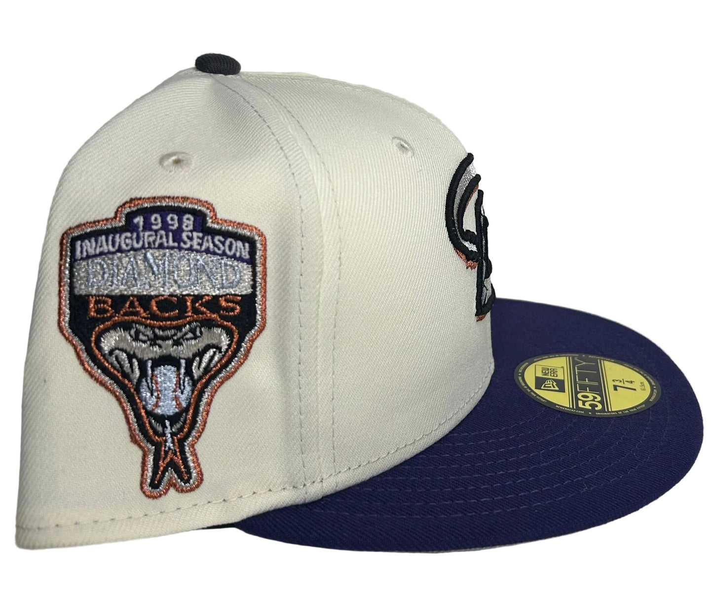 New Era Arizona Diamondbacks Cooperstown Collection 1998 Inaugural Season fitted hatfeaturing a prominent "D" snake logo and purple brim.