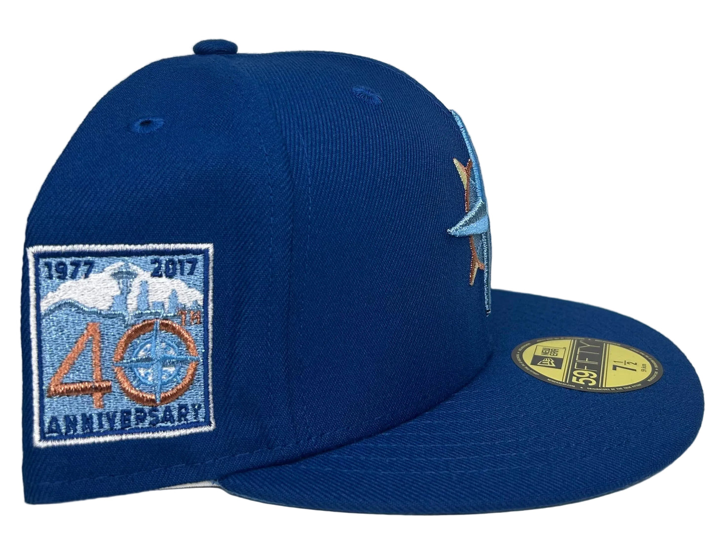 New Era Seattle Mariners 59FIFTY fitted hat featuring a light blue compass star logo and a 40th-anniversary side patch.