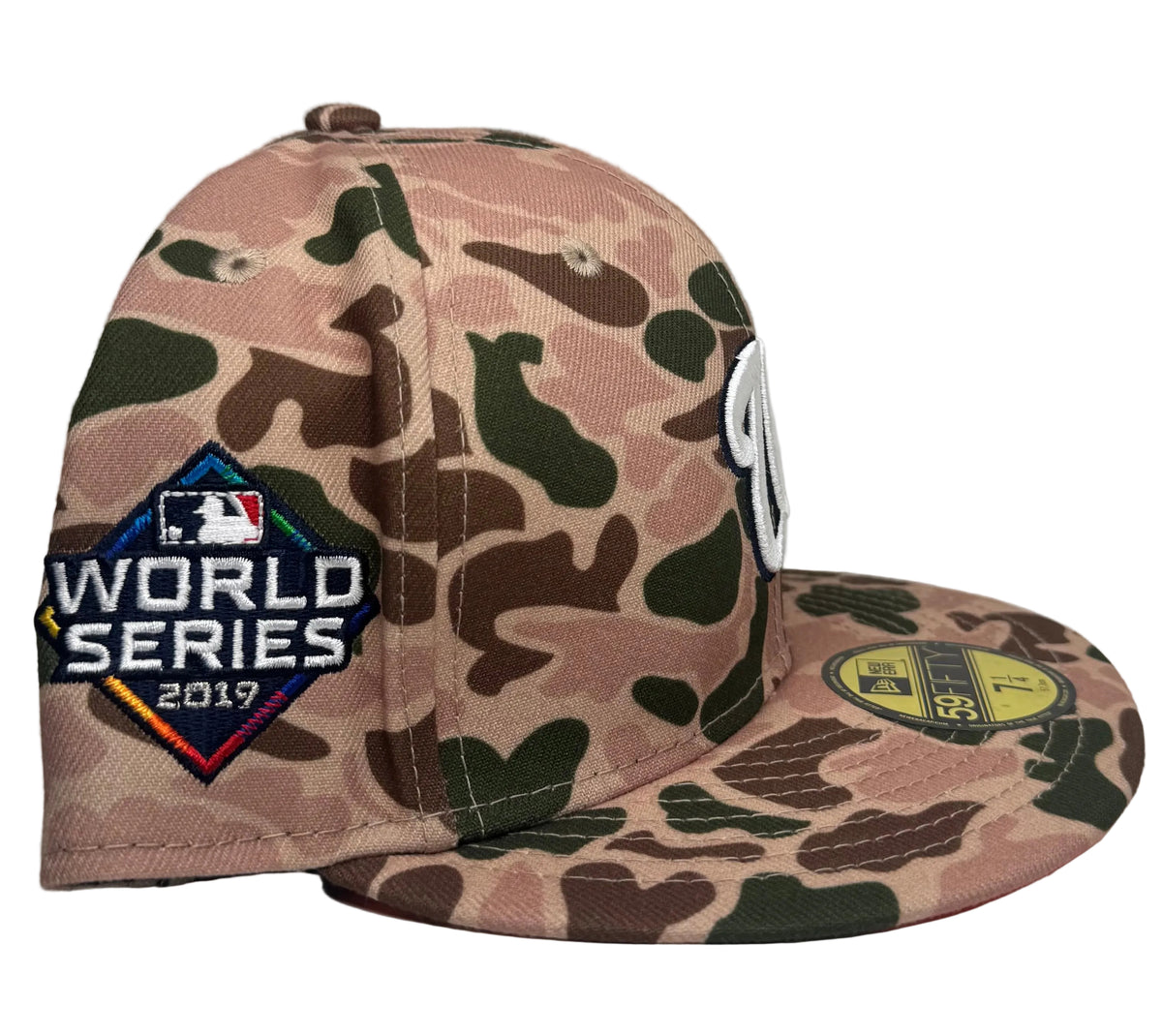 New Era Washington Nationals 2019 World Series Side Patch Duck Camo 59FIFTY fitted hat featuring a distinctive green and brown camo pattern with a contrasting orange undervisor.