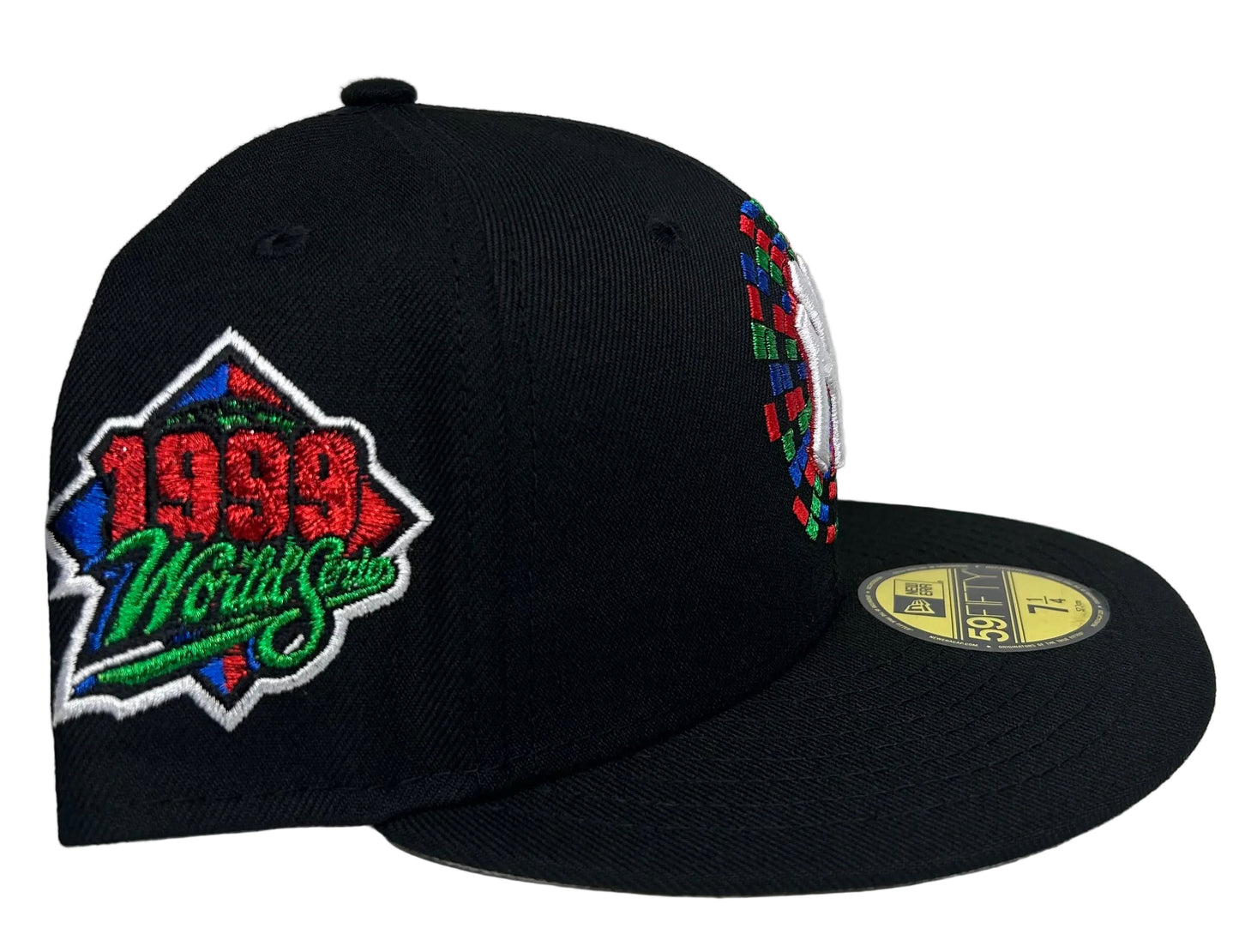 New Era New York Yankees 59FIFTY fitted hat featuring a black crown and a colorful embroidered circular side-and-front graphic with a 1999 World Series side patch