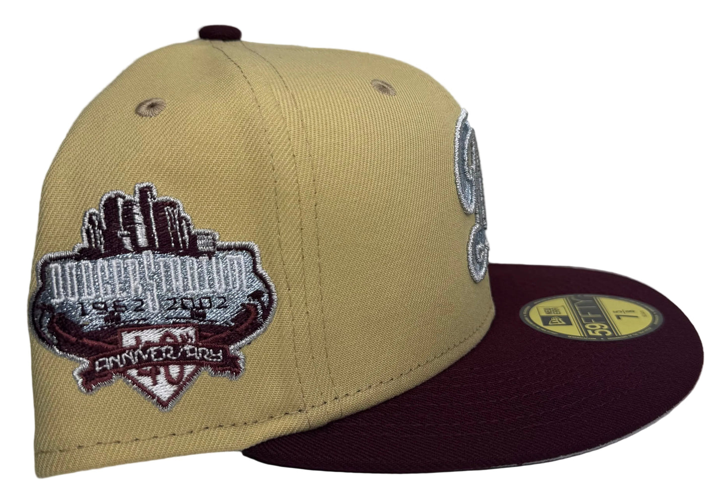 New Era Los Angeles Dodgers 59FIFTY fitted hat featuring a camel/vegas gold crown, a maroon visor, a silver script "D" logo, and a commemorative side patch.