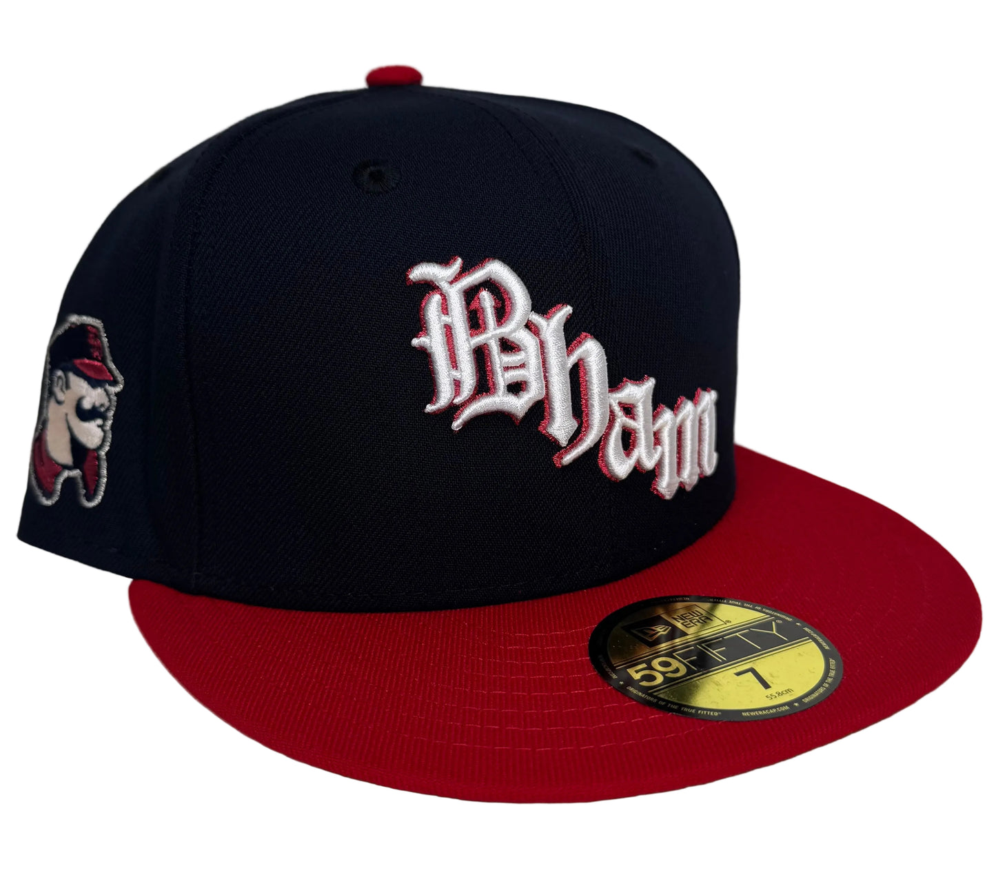 New Era Birmingham Barons Navy Throwback Two Tone Edition 59Fifty Fitted Hat featuring a navy crown, a red flat brim, and an old English "Bham" script embroidery on the front.