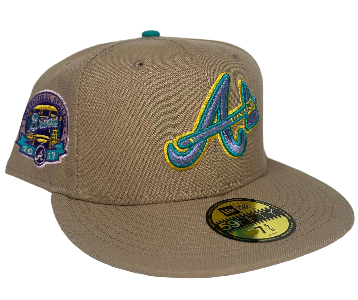 New Era Atlanta Braves 59FIFTY fitted hats from the Sandstorm Collection, featuring a tan colorway, a specialized side patch, and a vibrant pink under visor.