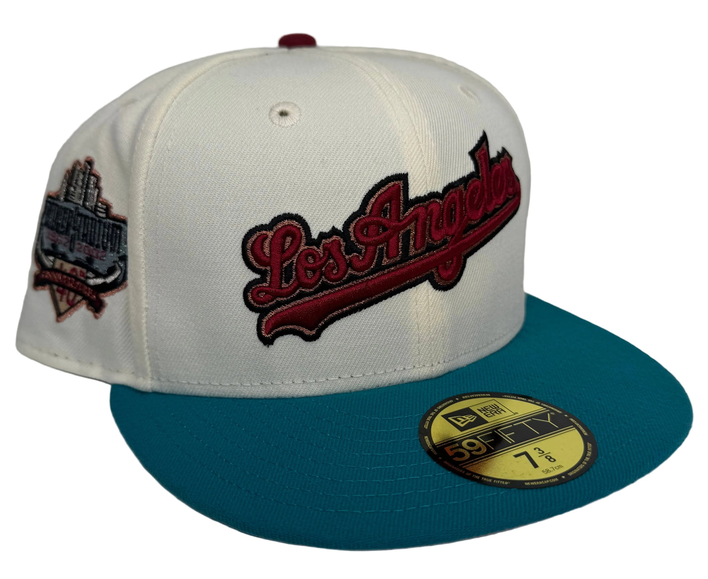 New Era Los Angeles Dodgers 59FIFTY fitted hat featuring an off-white crown, a teal flat bill, and a commemorative side patch.