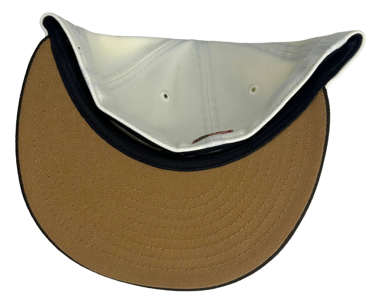 New Era Los Angeles Angels 25th Anniversary 59FIFTY Fitted Hat featuring a cream-colored crown, brown visor, and a special side patch.