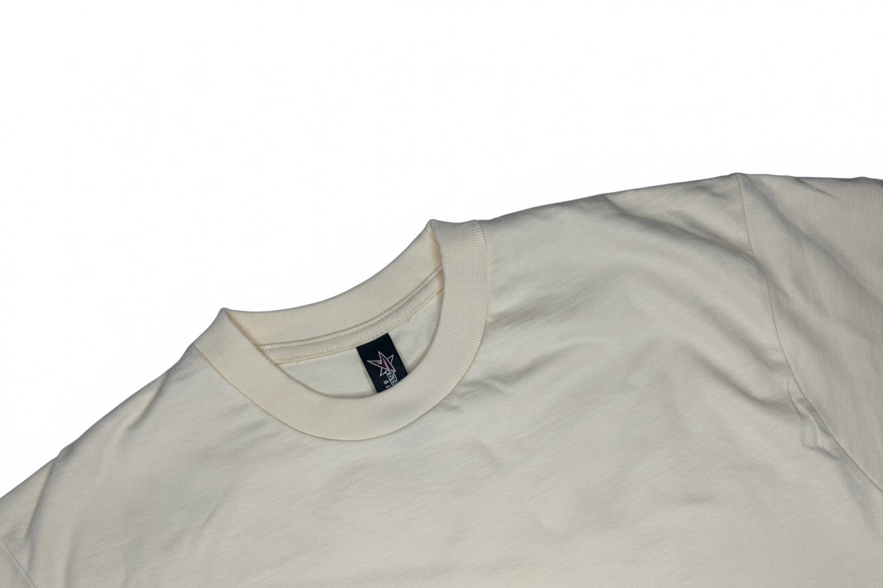crewneck t-shirt by Startex features a lightweight fabric construction cream-colored, blank.