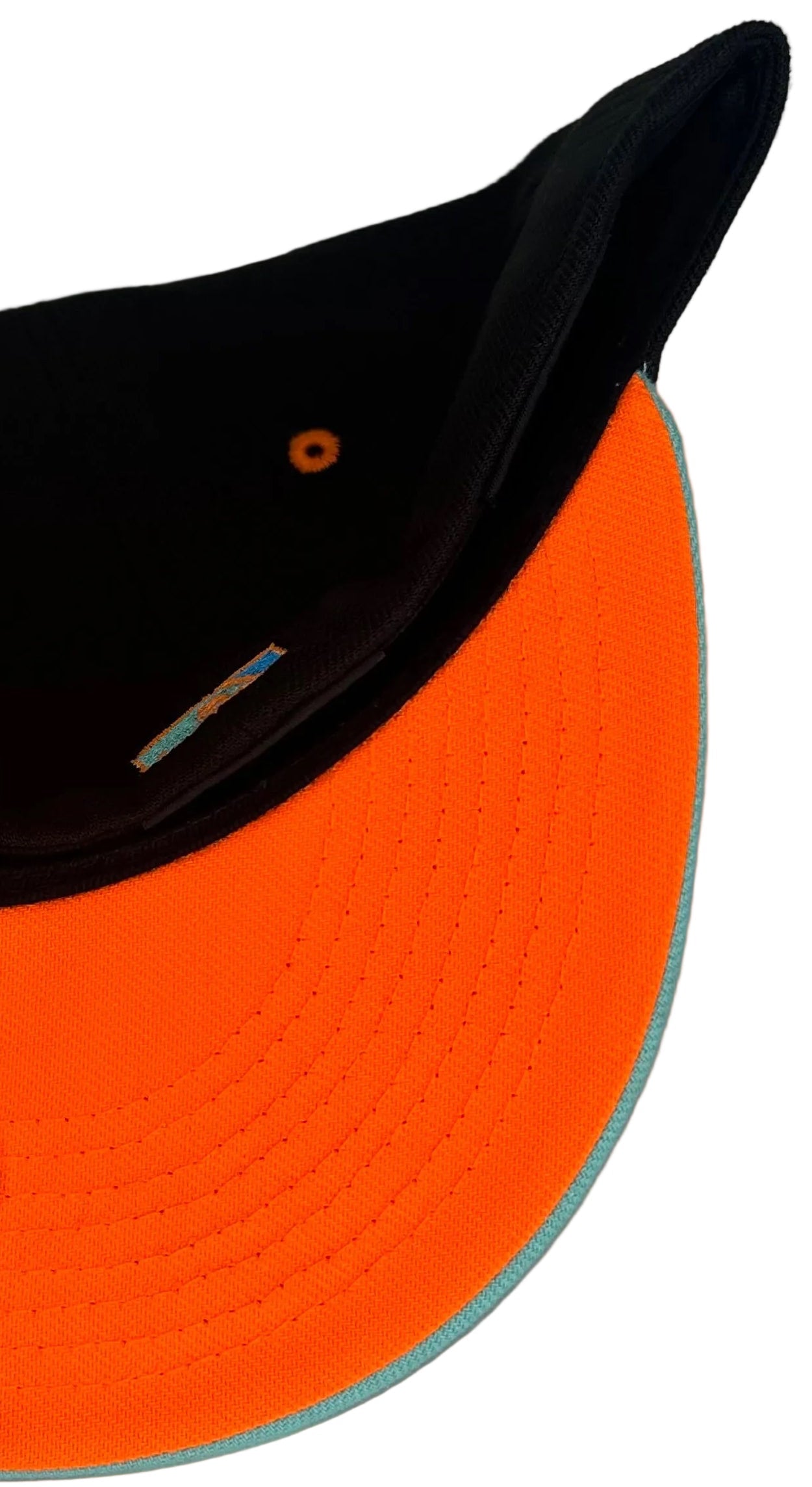 New Era Anaheim Angels 50th Anniversary fitted cap featuring a black crown and a distinct teal brim.