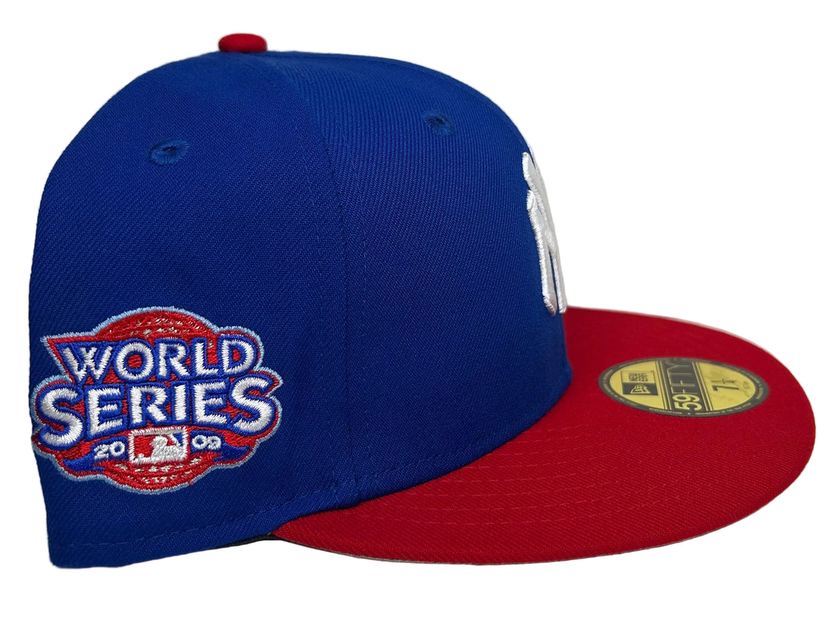New Era 59FIFTY New York Yankees fitted hat featuring a royal blue crown, red flat visor, and a commemorative World Series side patch.