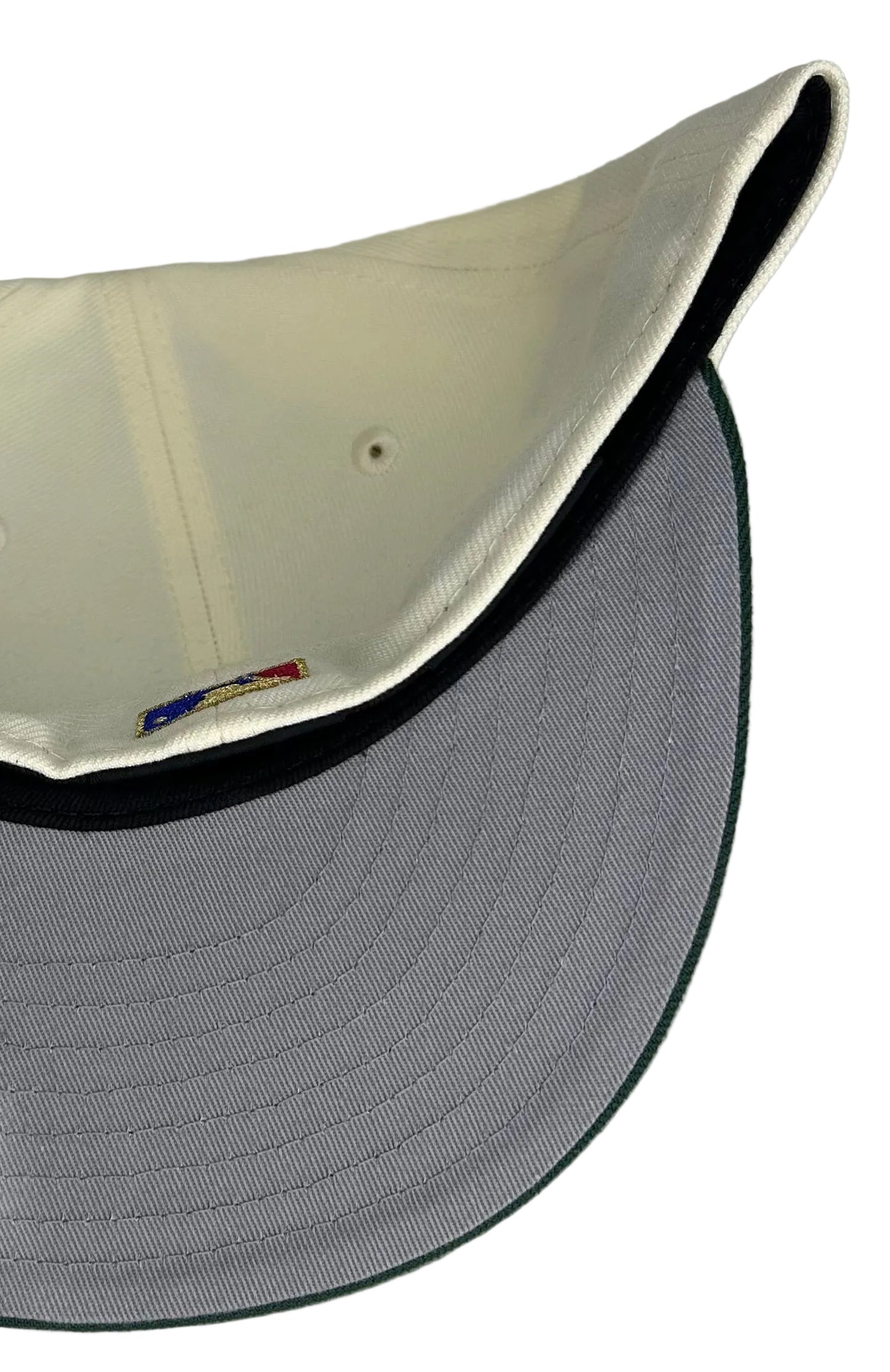 New Era Philadelphia Phillies 59Fifty fitted hat features a distinctive cream-colored crown, a dark green visor, and a special 1939 Baseball Centennial side patch.